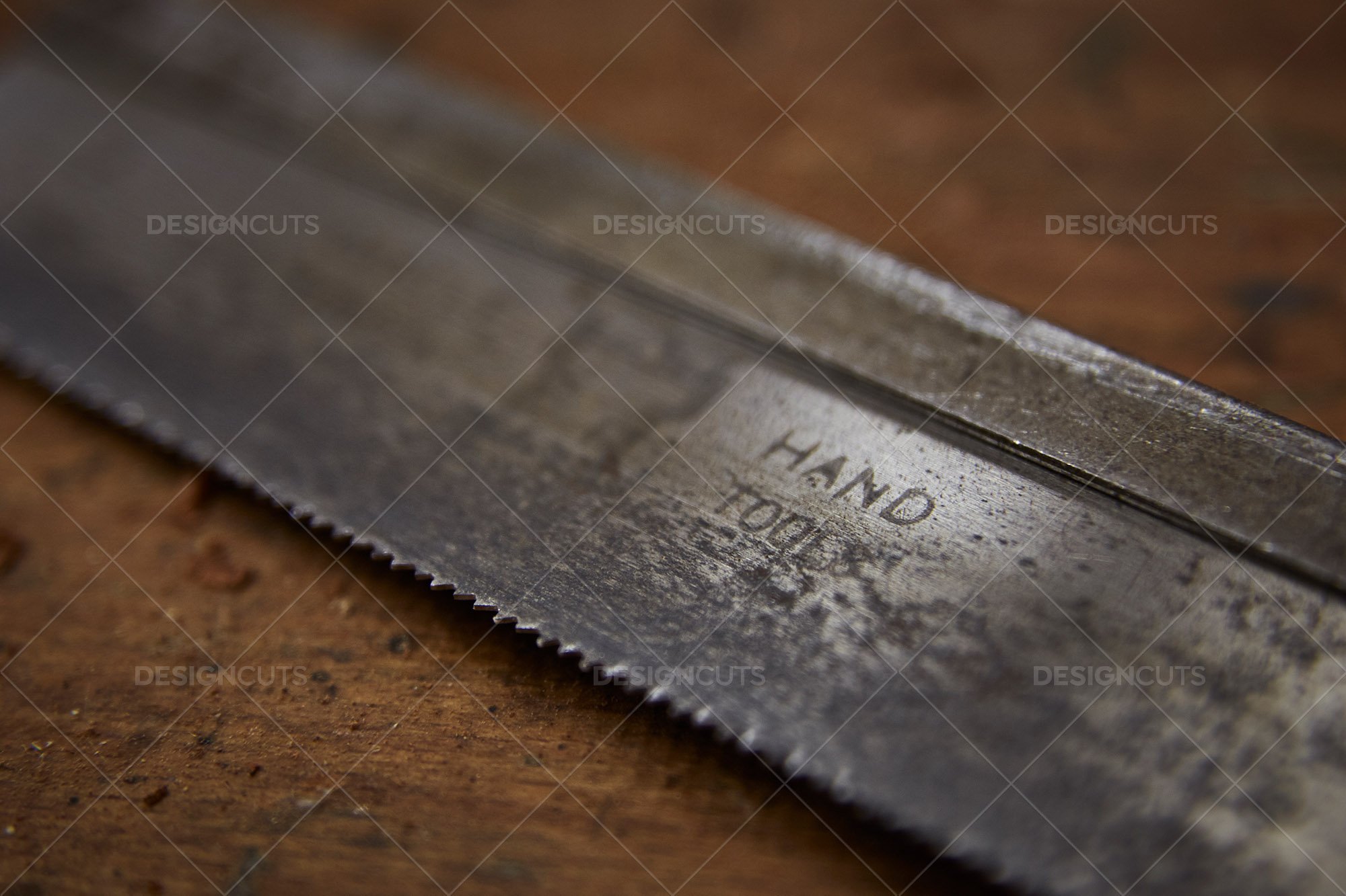 Closeup Of Rusty Hand Tool On Wood Work Surface